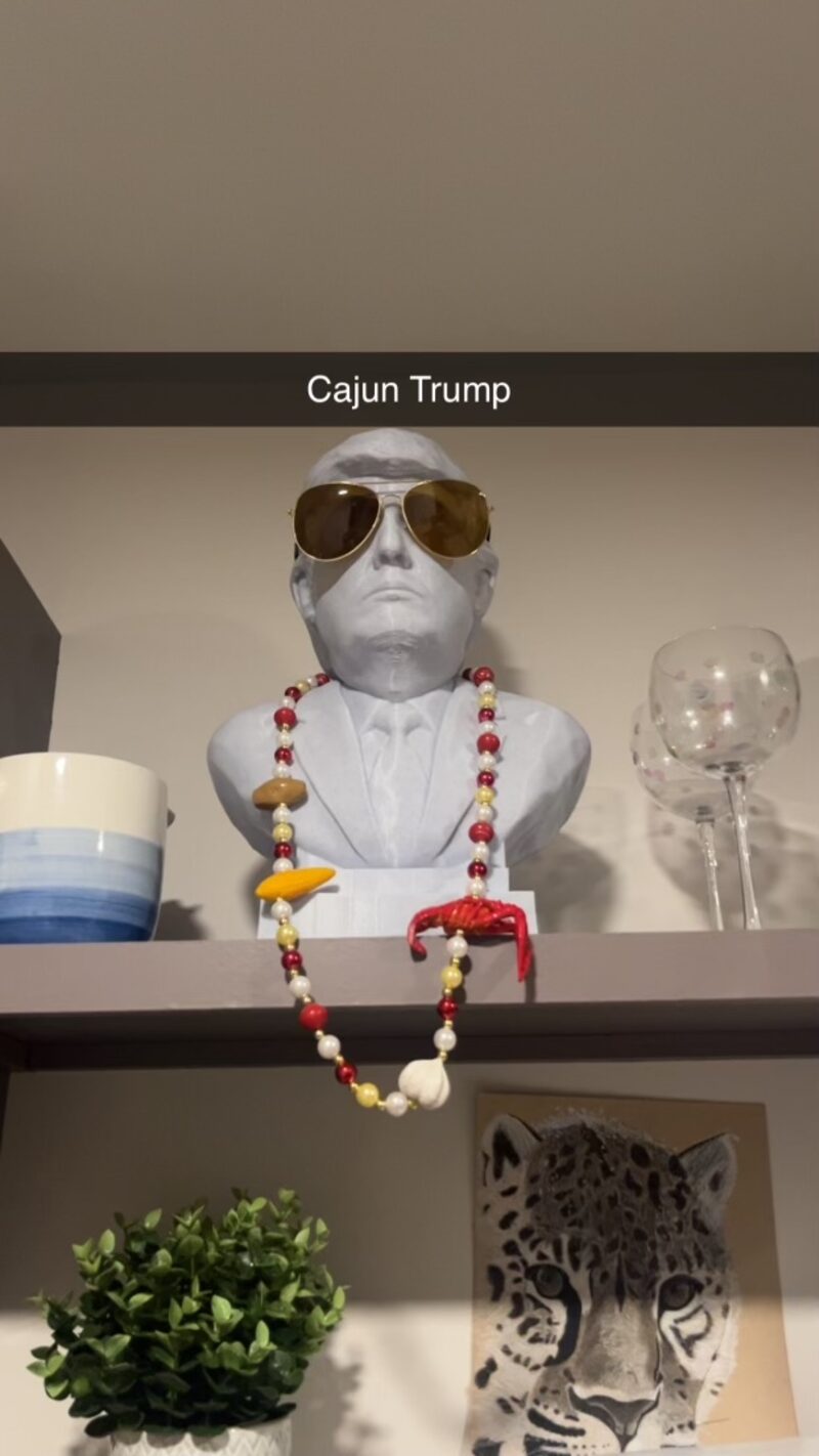 Trump bust Cajun edition with Mardi Gras beads and gold aviators